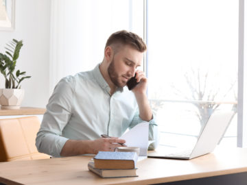 small business owner researches sba loans vs online business loan options